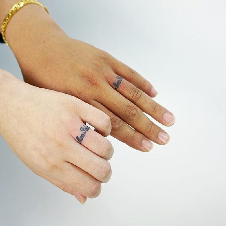 two left hands with wedding ring tattoo scipts