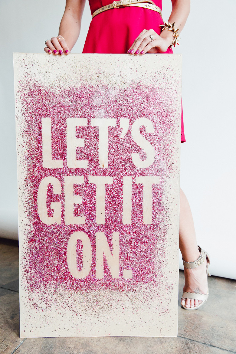 girl holding glitter board that says let's get in on