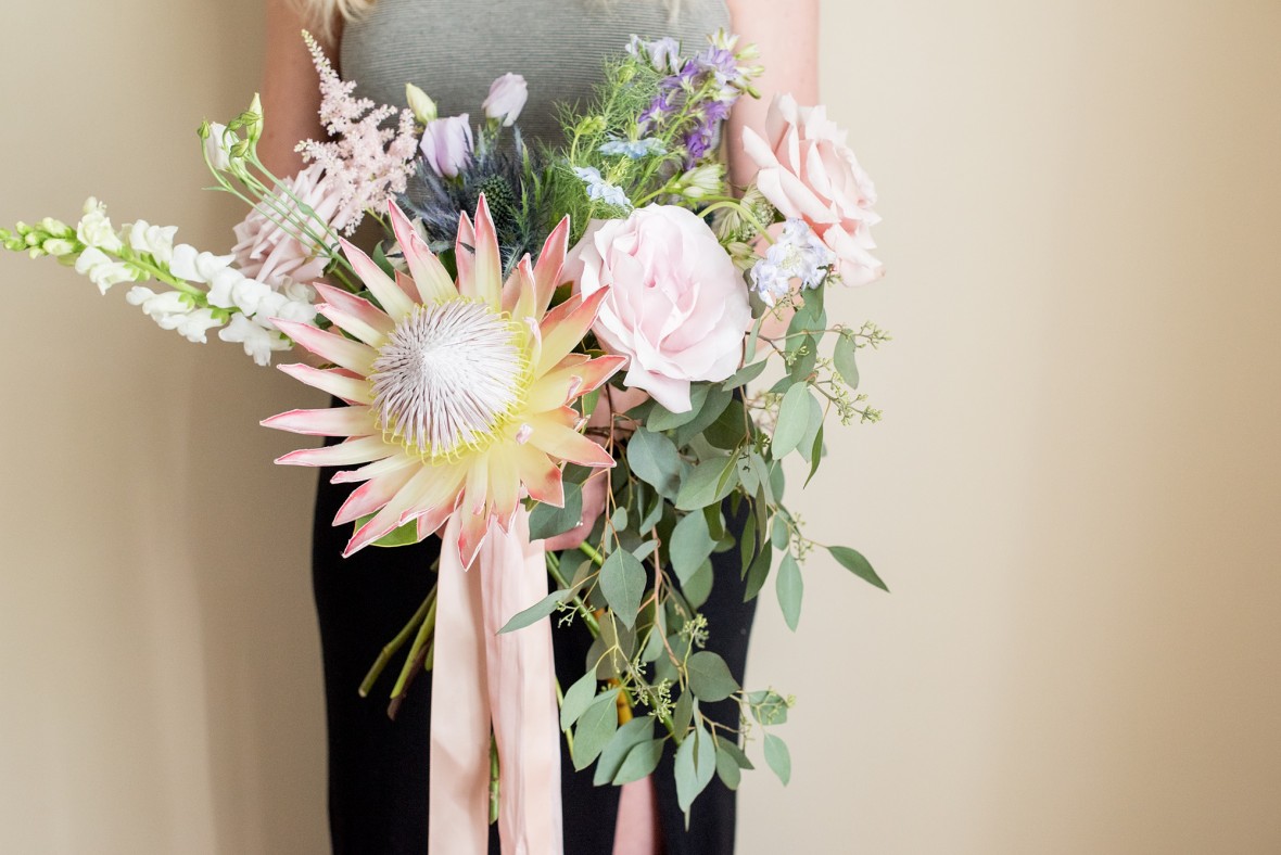 Peony and garden rose bouquet, whimsical designs with horizontally focused greenery with short ribbons