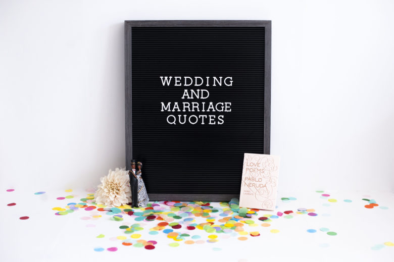 Black board on confetti that says wedding quotes and marriage quotes