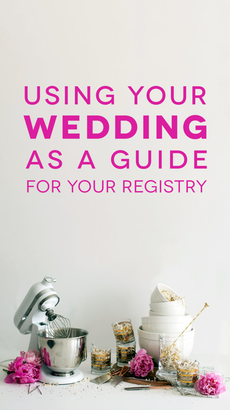 Kitchenaid mixer, gold accented old fashioned glasses, white mixing bowls, cheese knives, and bar tools, pink flowers beneath pink text reading "Using Your Wedding as a Guide for Your Registry"