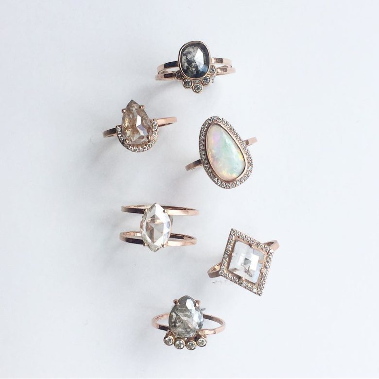 An overhead view of five different engagement rings.