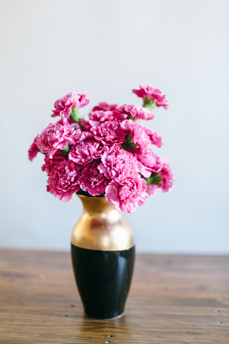 hot pink carnations in a diy painted metallic gold vase