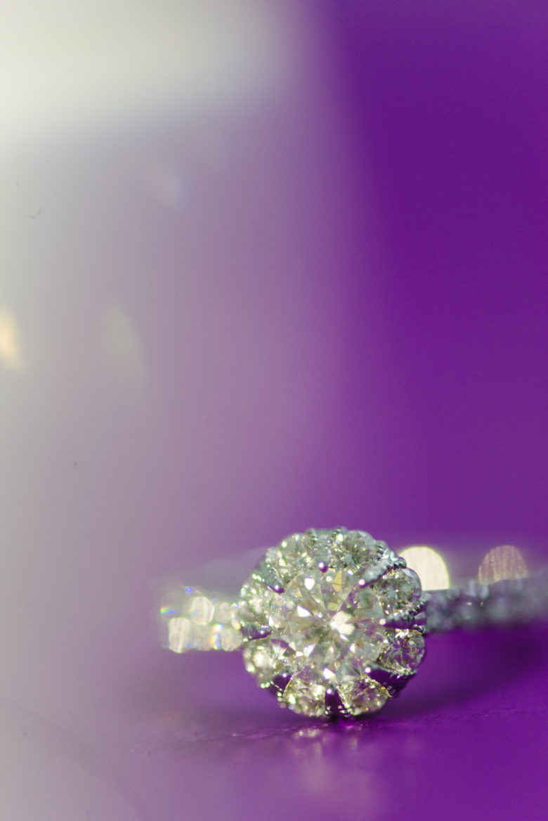 macy's vintage inspired halo star signature diamond engagement ring on purple gradient background