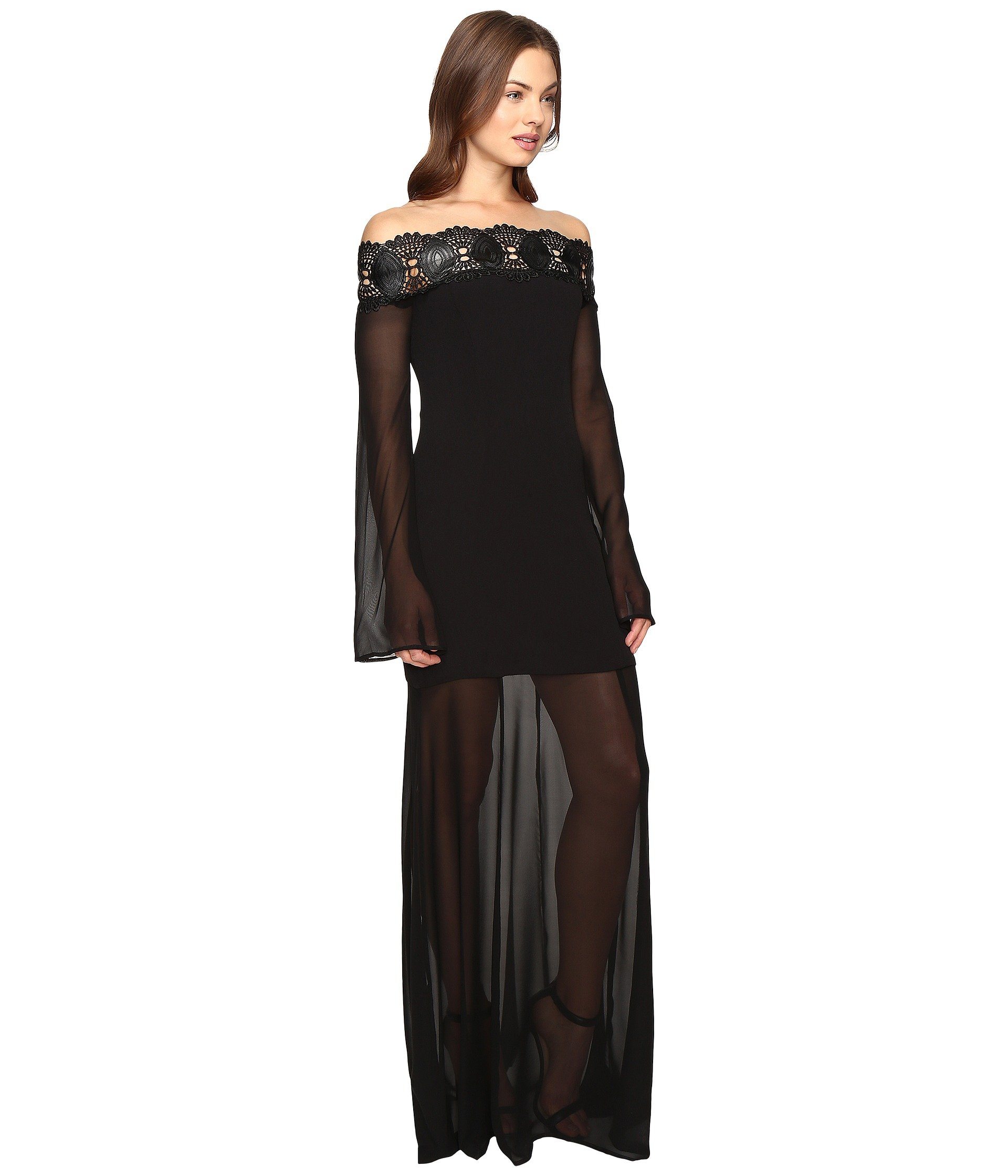 Brunette mode in off the shoulder Stone Cold Fox maxi dress with sheer skirt
