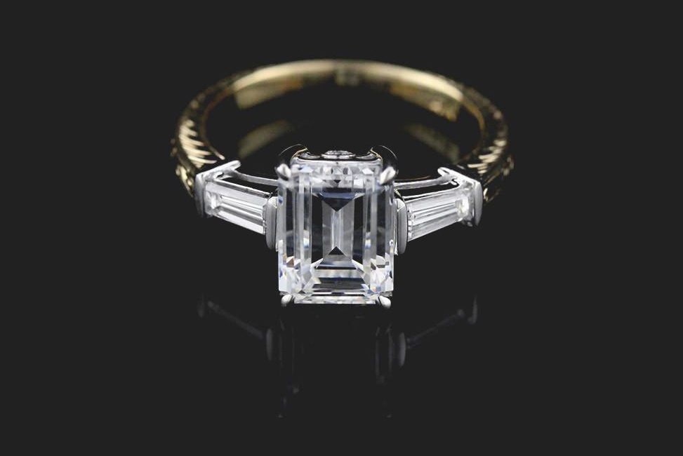 conflict-free emerald cut two tone diamond engagement ring