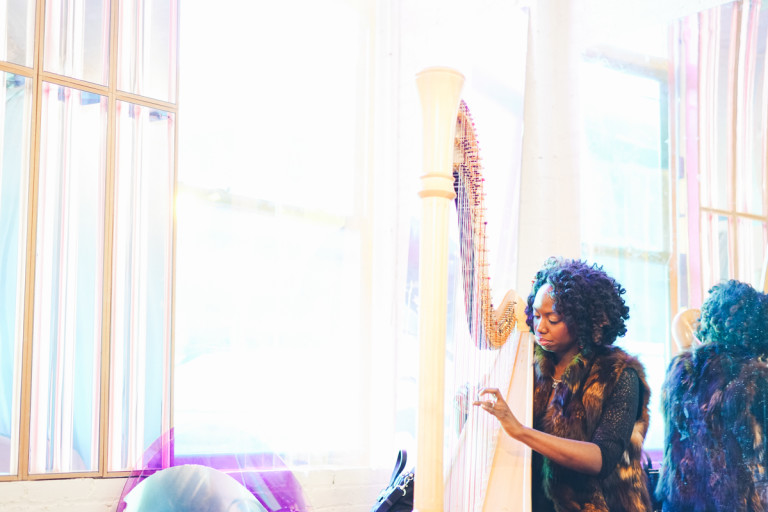 a harpist plays during a reception