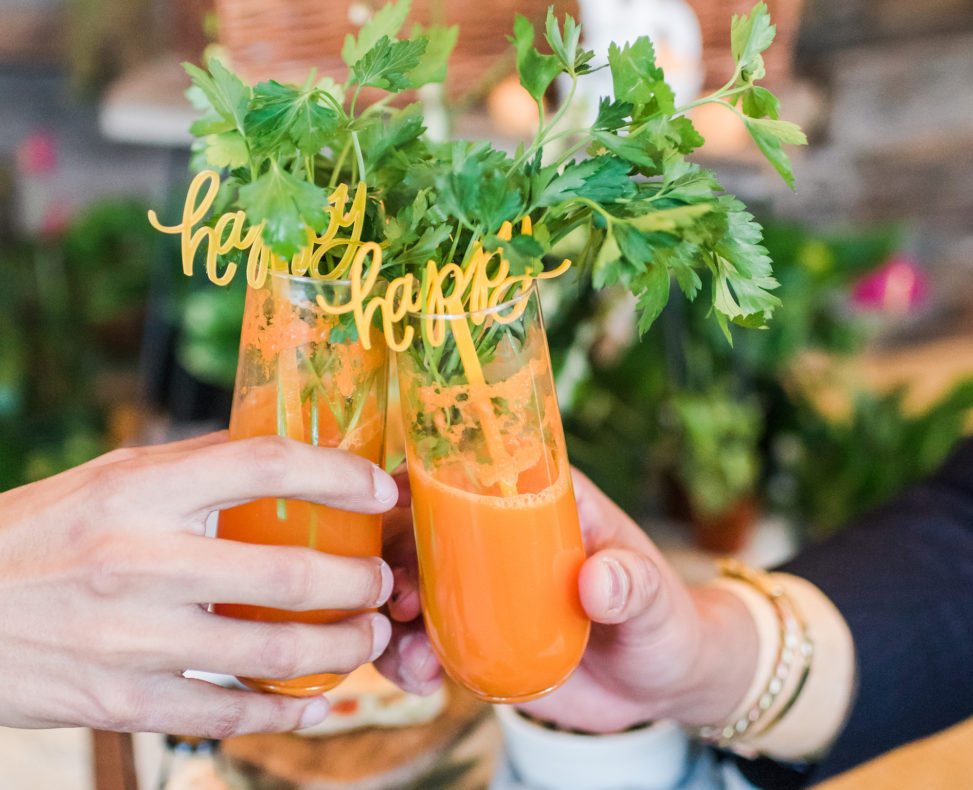 two glasses full of carrot juice 