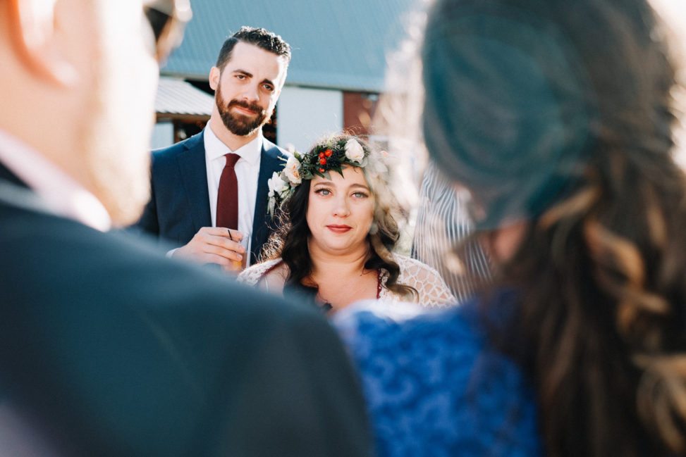 A bride looks at her parents during a speech