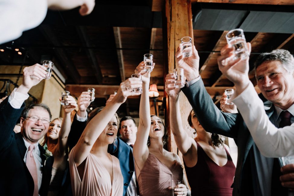 Everyone raising their glasses for a toast