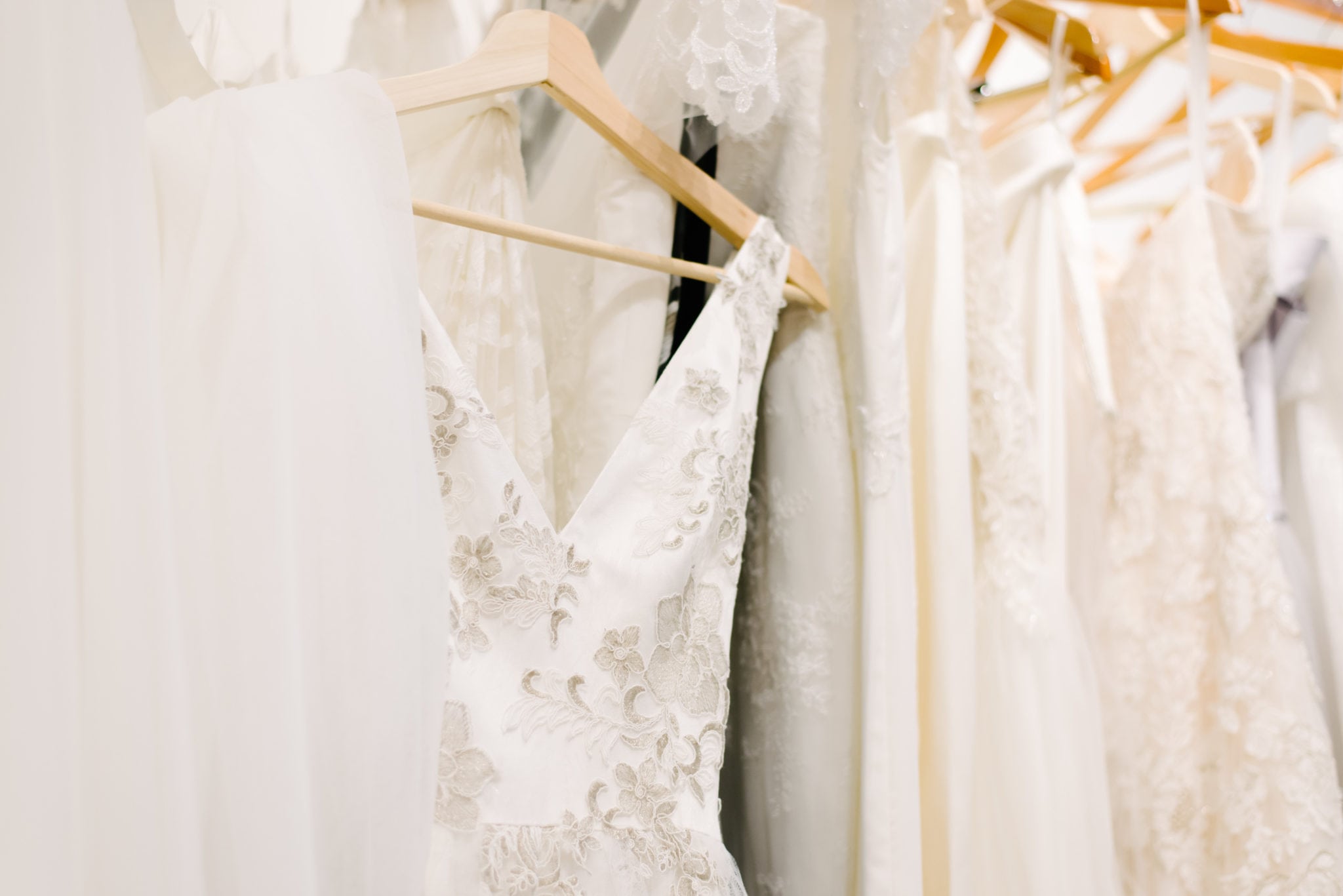 Photo of wedding dresses hanging