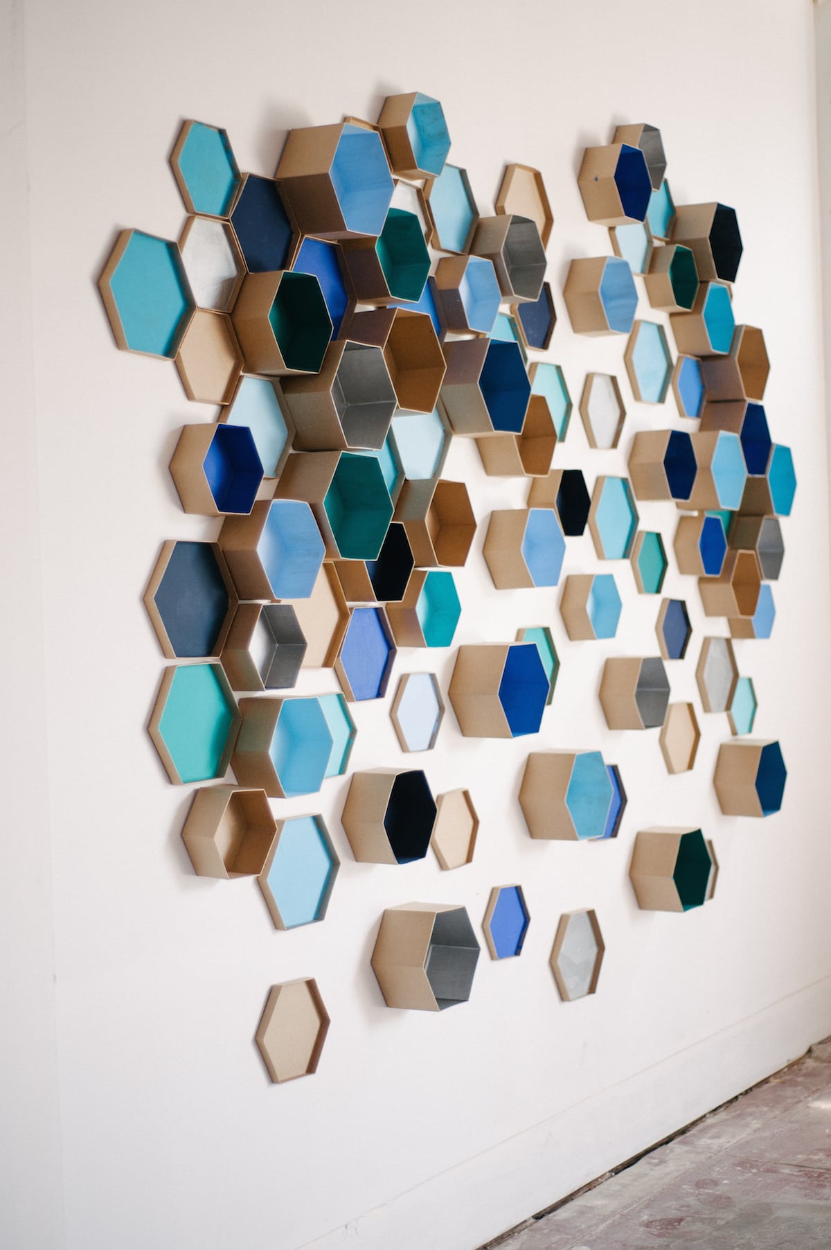 a wall covered with hexagon shapes for a DIY photo booth backdrop